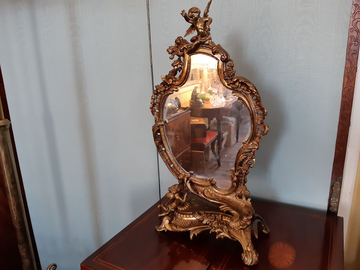 Edwardian Rococo-style gilt bronze & frame toilet mirror with cherub mounts.